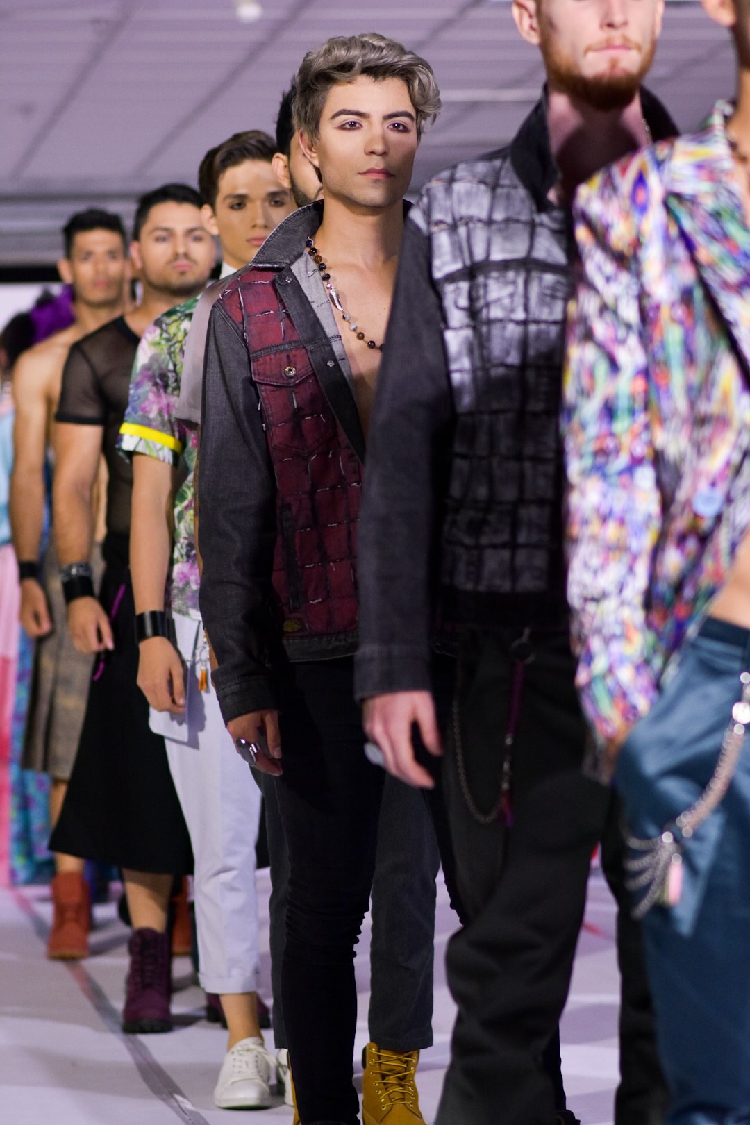 Fashion runway show with models walking